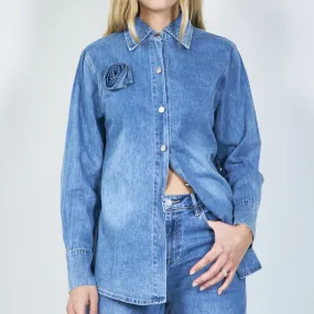 Classic denim shirt with floral accent wholesale